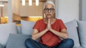 Older adult woman sitting on couch