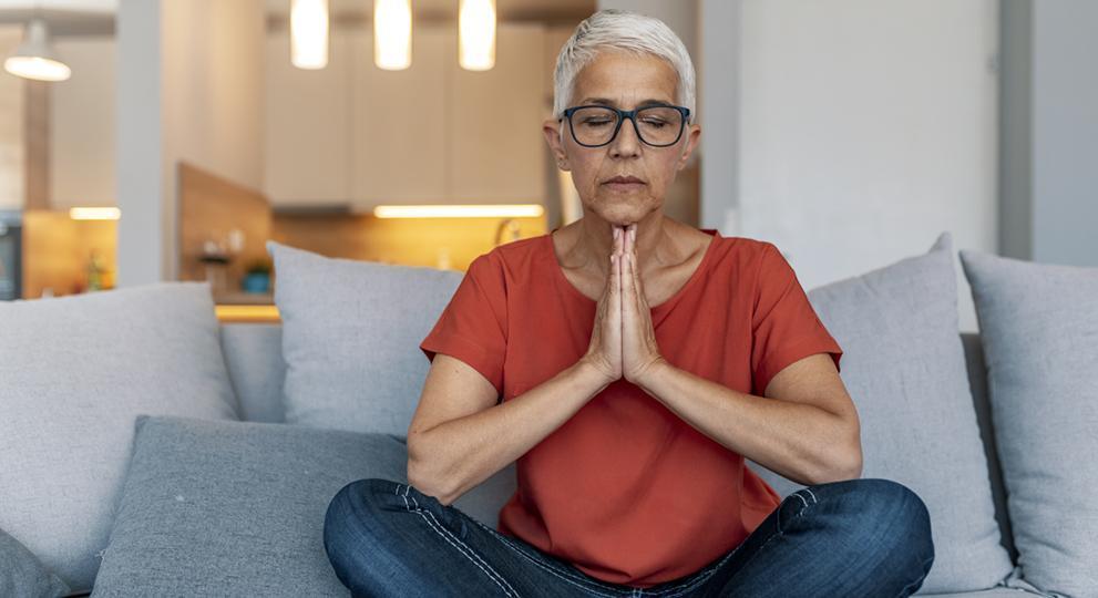 Older adult woman sitting on couch